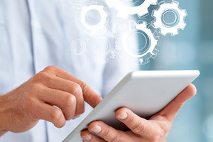 Digital Innovation with Tablet and Gears Overlay, a Business Photo by AlyaAnd