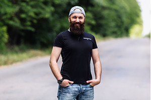 Smiling brutal man with a long beard, a Nature Photo by Red Hot Chili Pepper Shop