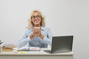 Cup of tea and chill. Happy young office worker drinking hot beverage and dream, a Photo by Prostock-Studio (Thumbnail 2 of 2)