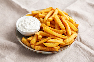 Homemade French Fries With Ranch Dressing On A Plate, Low Angle