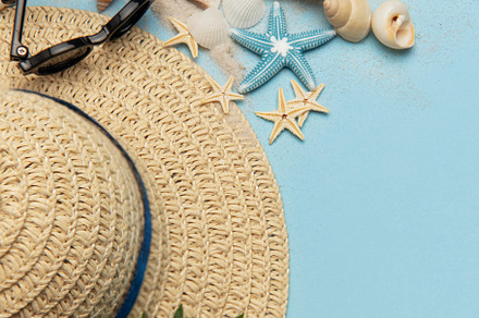 Summer holiday beach background with seashells, sunglasses and s