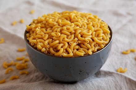 Bowl of Dry Organic Macaroni Elbow Pasta, Ready to be Cooked. Cl, a Food & Drink Photo by LiudmylaChuhunova