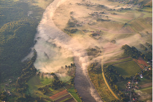 Aerial shot of a misty river at, a Nature Photo by Oleksandr Berezko