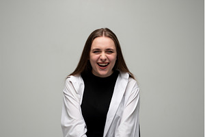 Young woman bursting with laughter, a Person Photo by volodymyrshtun13795