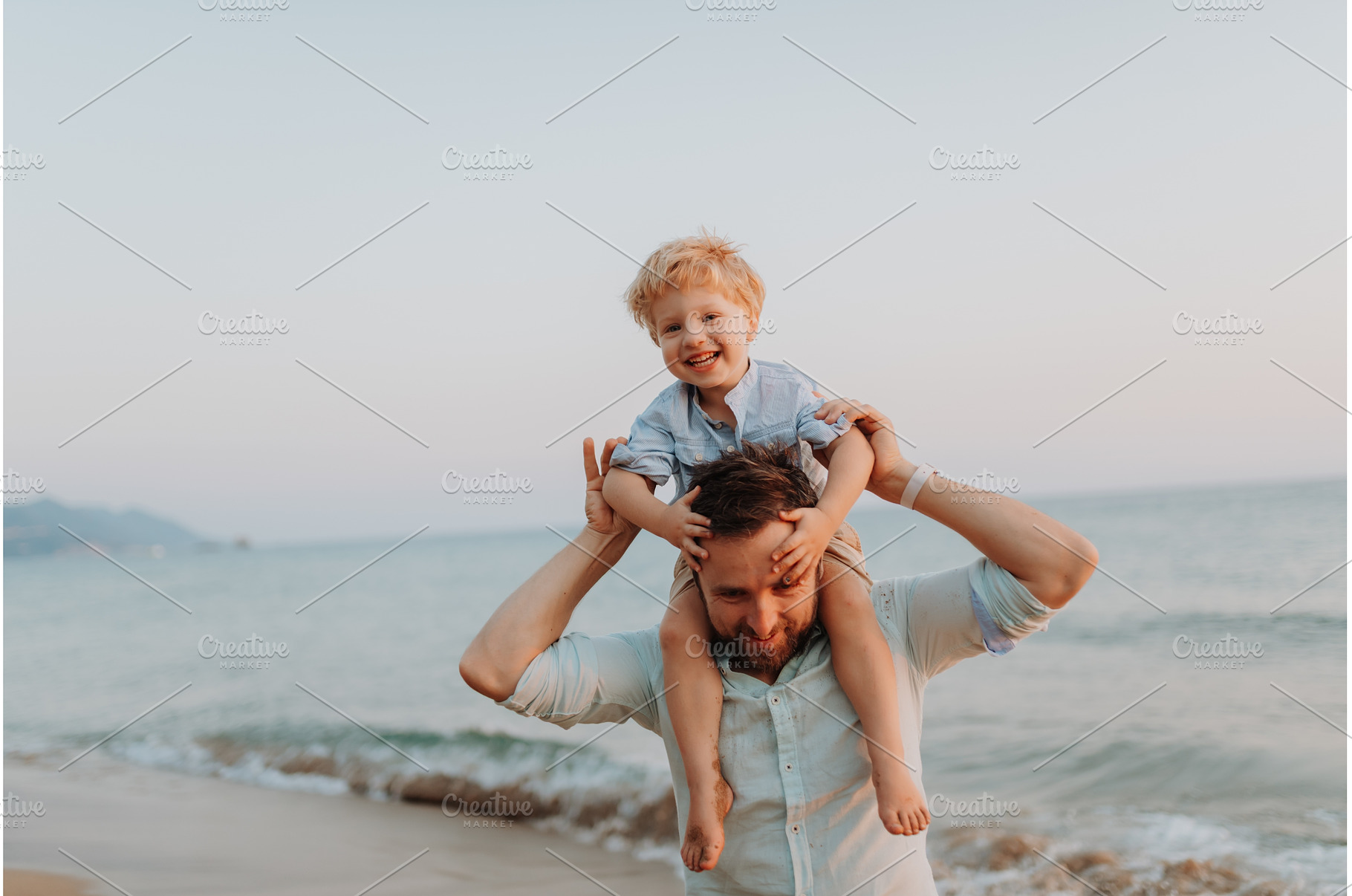 Father carrying toddler on the, a Person Photo by HalfPoint