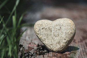 Stone heart shape on wood stock photo containing heart and stone