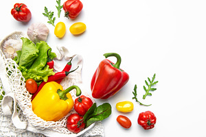 Fresh organic vegetables in mesh shopping bag, a Photo by Olena Rudo