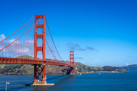 Golden Gate Bridge over blue waters with scenic hills in San Fra, an Architecture Photo by GoodGoods