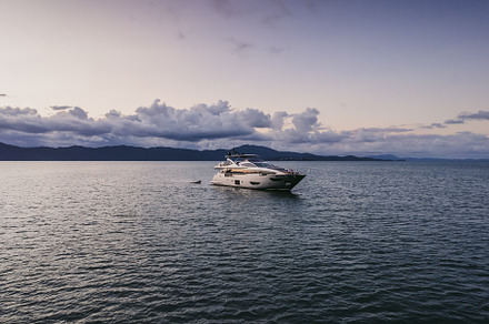 Beautiful yacht at sunset in the ocean., an Architecture Photo by Rov.7