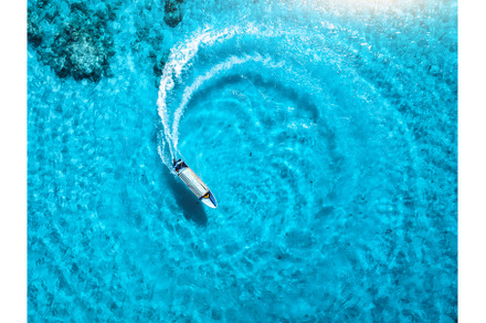 Aerial drone view of the speed boat, a Nature Photo by den-belitsky