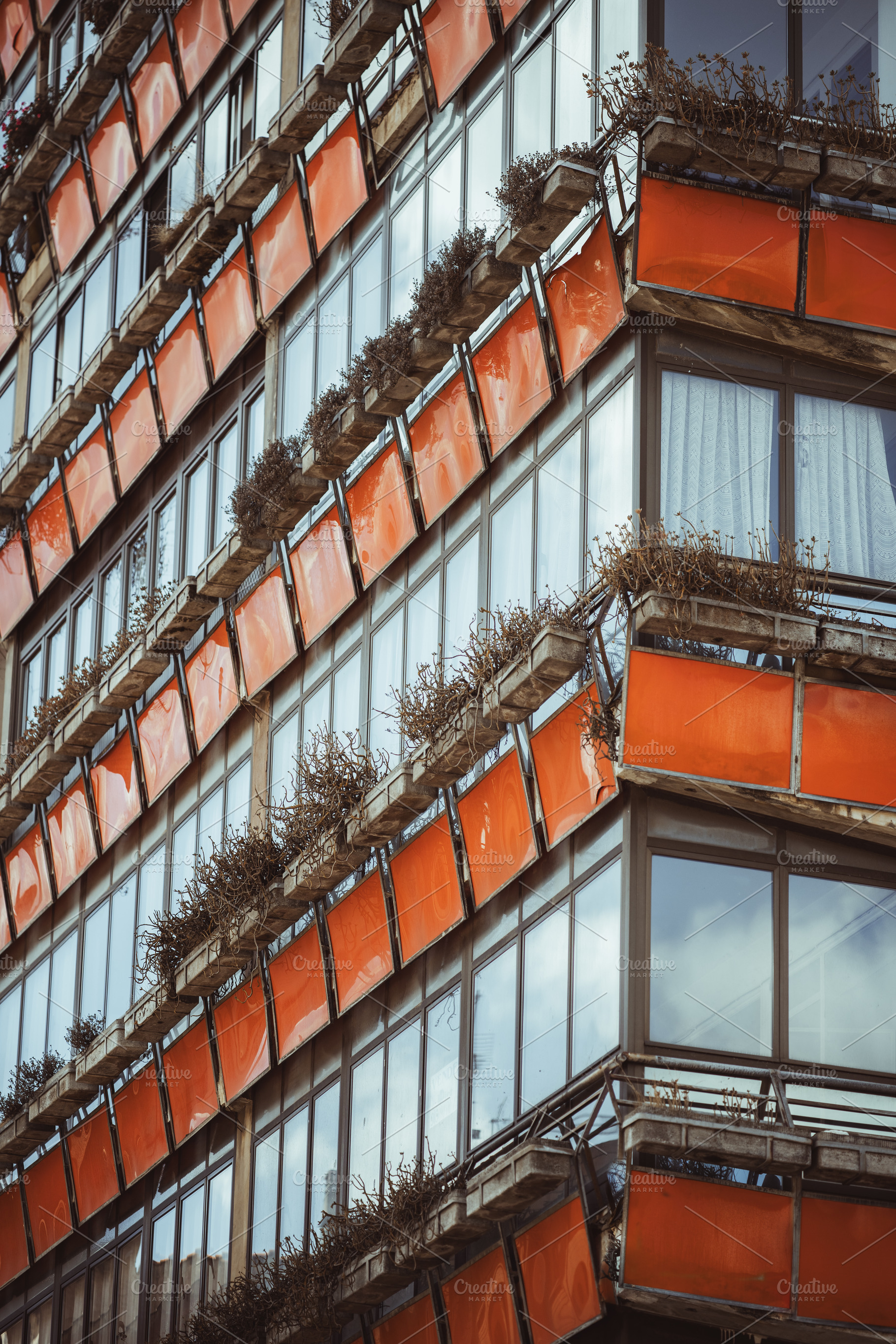 Modernist orange building Tineo, an Architecture Photo by SkyNext