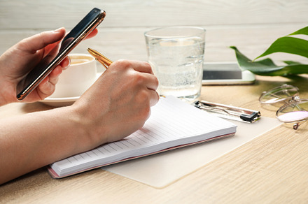 Girl writes in a notebook. Business or blogger concept, a Beauty & Fashion Photo by AtlasStudio PRO