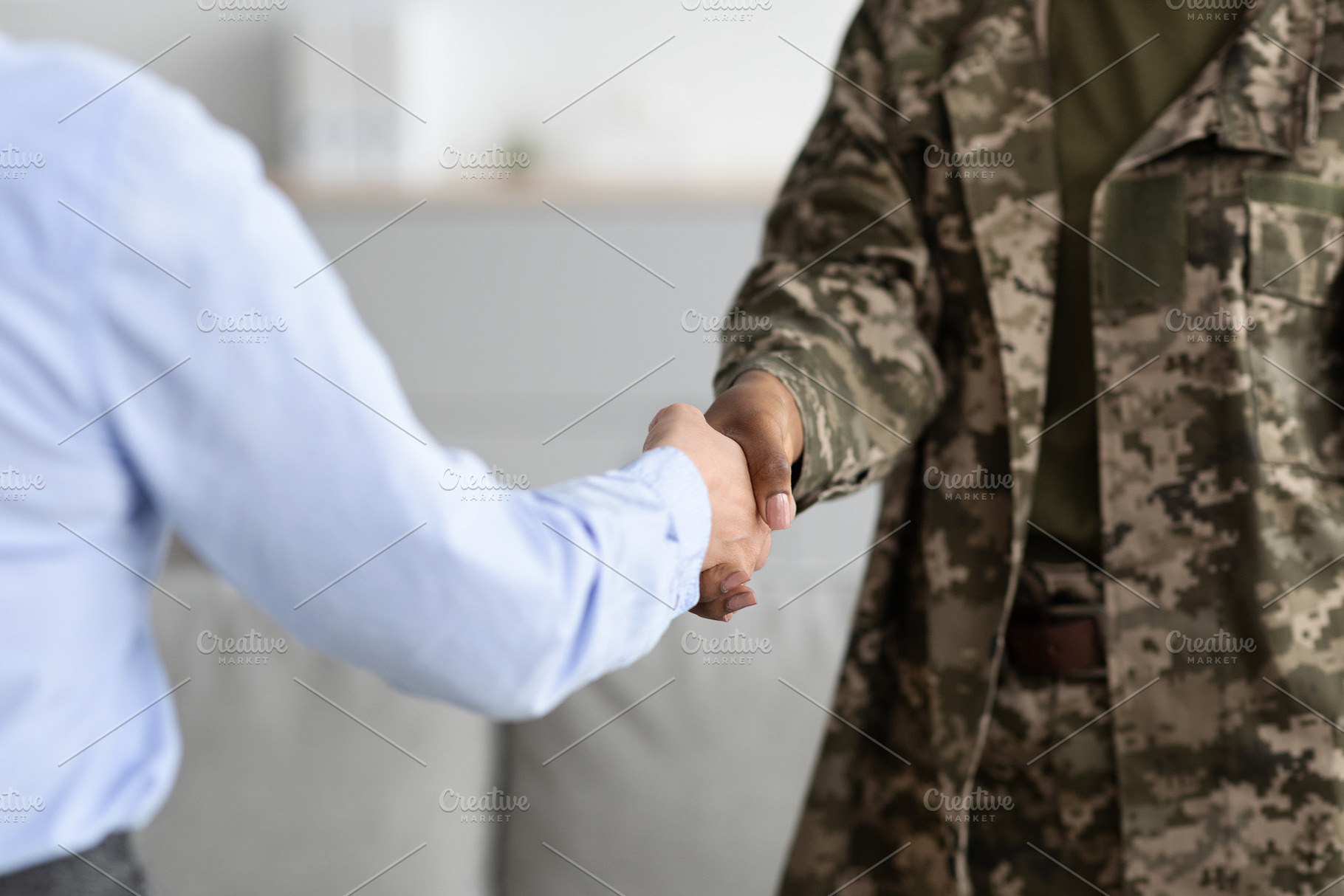Closeup Shot Of Black Female Soldier Handshaking With Psychotherapist Woman, a Photo by Prostock-Studio