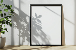 Poster frame mockup leaning against, a Background Photo by MistyDay