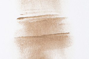 Chaotic strokes of foundation on isolated background, cosmetics, an Abstract Photo by ndanko