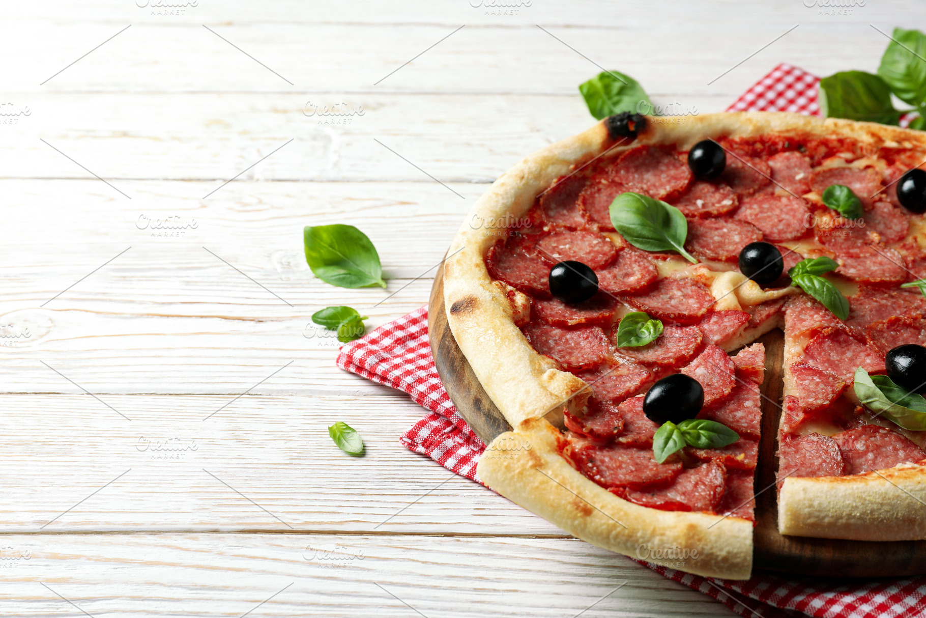 Concept of tasty food with Salami pizza on white wooden backgrou, a Food & Drink Photo by AtlasStudio PRO
