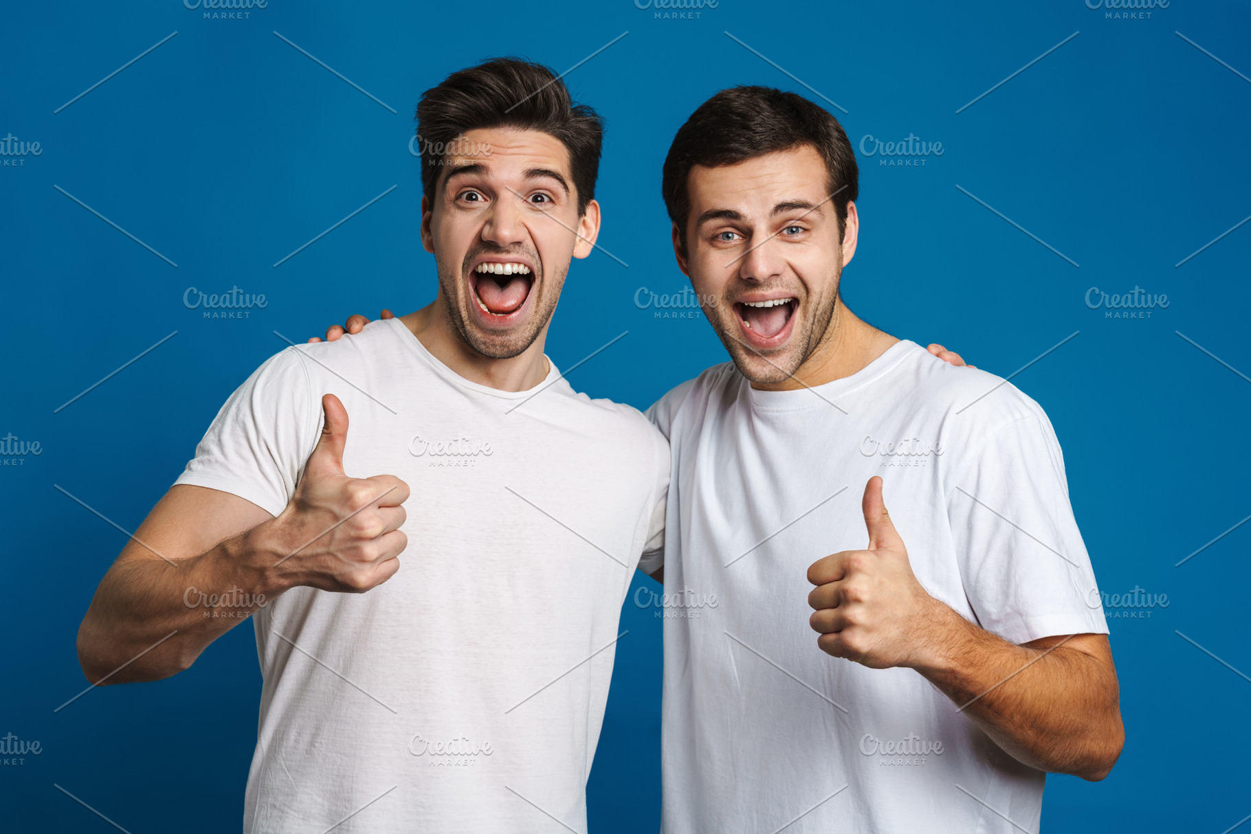 Joyful handsome guys screaming and showing thumbs up, a Person Photo by ...