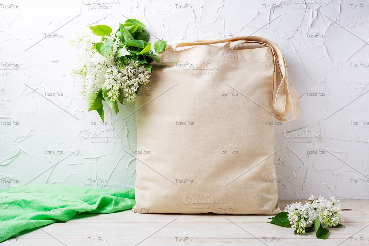 Tote bag mockup with white lilac, a Merchandise Mockup by TasiPas (Photo 3 of 4)