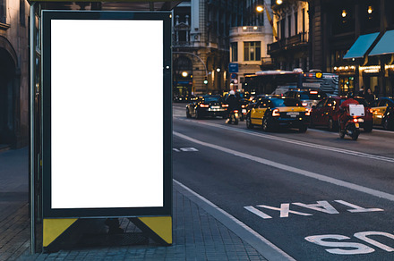 Bus stop in city featuring lightbox, billboard, and banner, an Industrial Photo by A_B_C