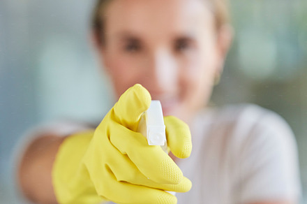 Hand, spray bottle and cleaning with a woman in gloves for housework or sanitization for hygiene. Hands, latex and disinfectant with a female cleaner spraying product to clean for a fresh wash, a Photo by Peopleimages.com