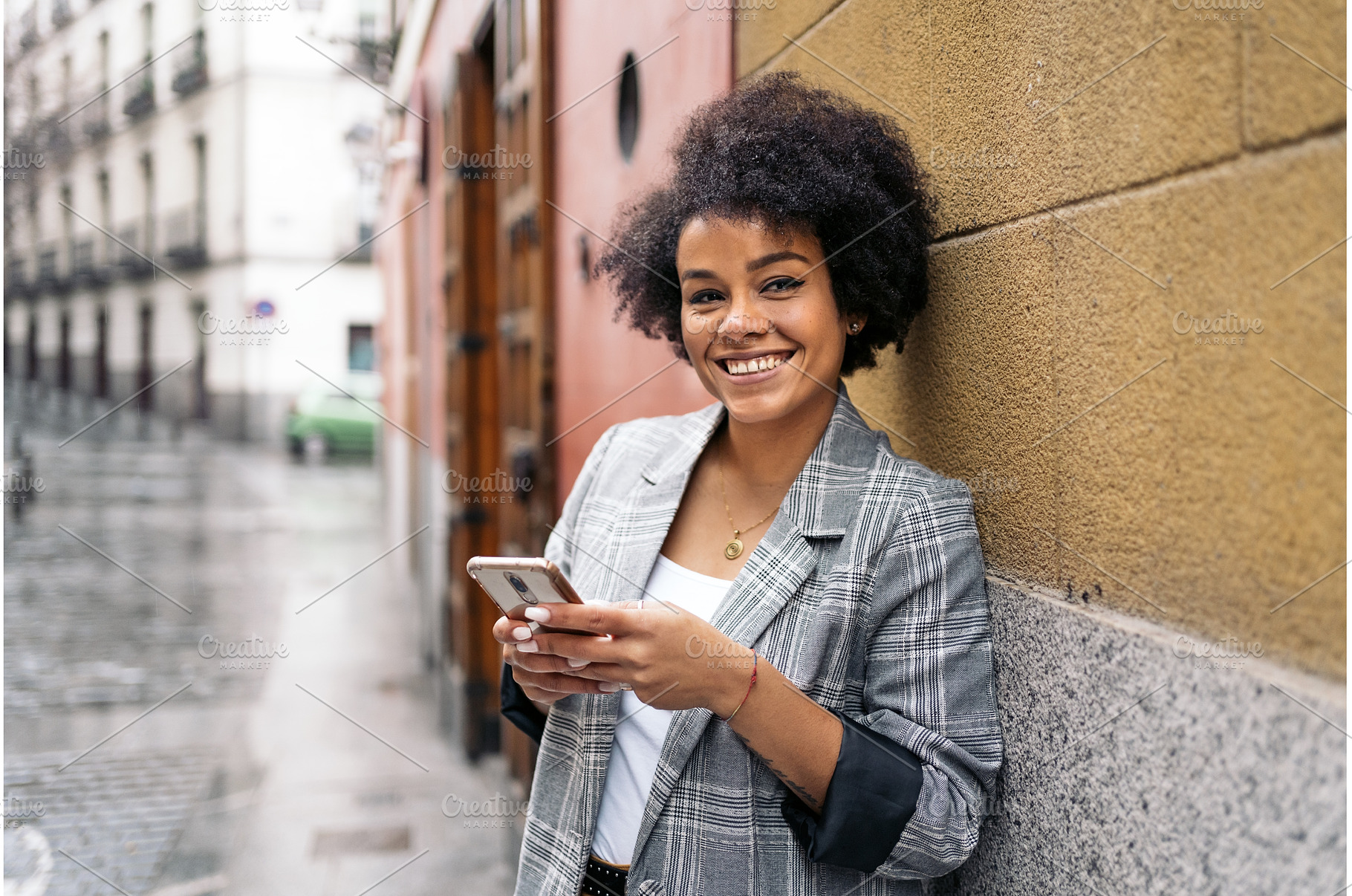 Pretty Afro Woman Using Phone, a Beauty & Fashion Photo by nunezimage
