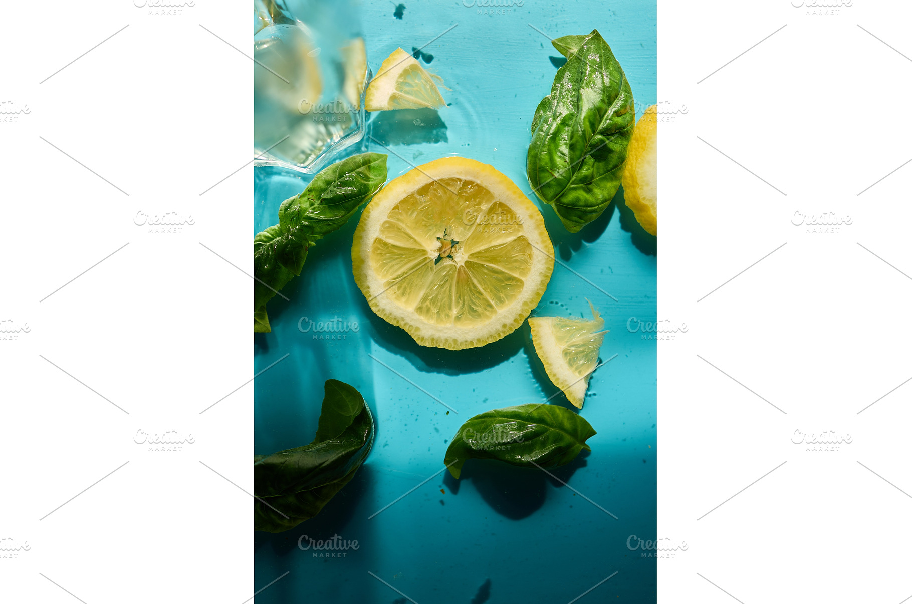 Fresh lemon slices with basil and, a Food & Drink Photo by IlliaBondarPhotography