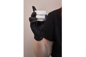 Hand in black glove holding white, a Beauty & Fashion Photo by wip3out