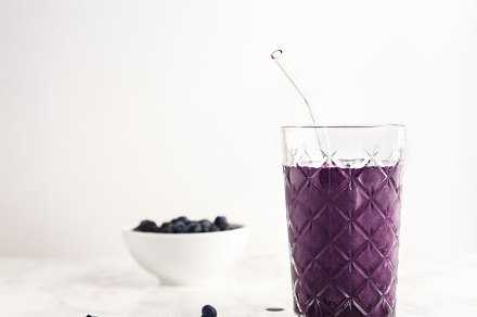 Blueberry smoothie in glass featuring smoothie, modern kitchen, and healthy