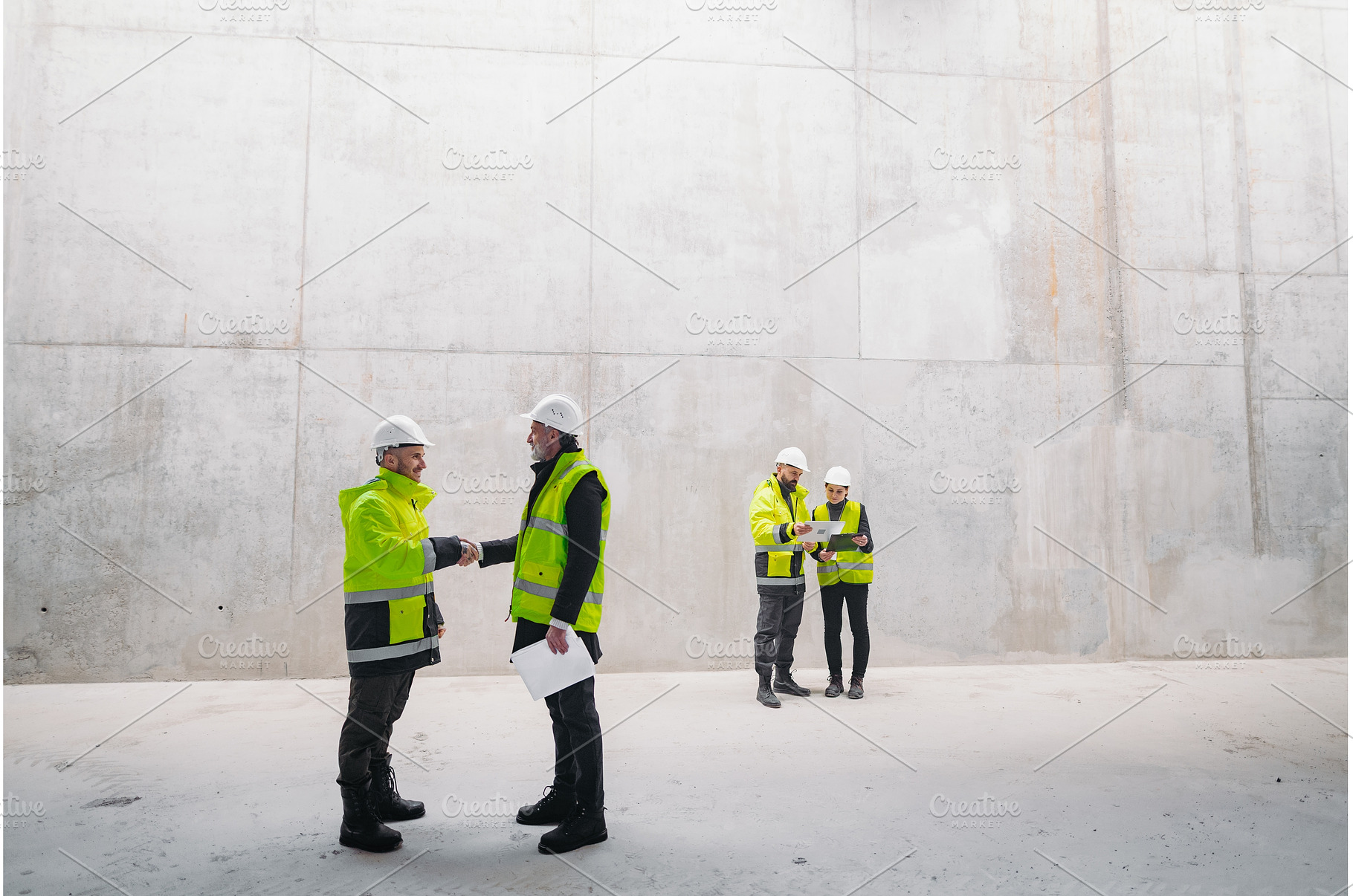 Engineer shaking hand with, a Person Photo by HalfPoint