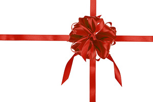 Red silk ribbon bow and cross ribbons on isolated background, gi, a Holiday Photo by ndanko