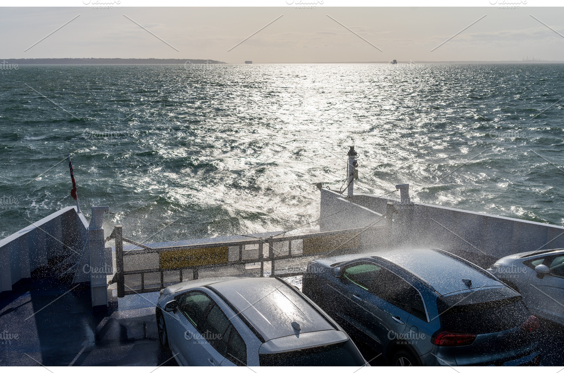 Sea spray drenches cars on ferry, an Architecture Photo by Backyard Stock