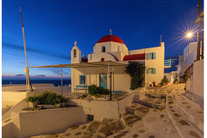 Church with red dome at blue hour in, an Architecture Photo by kavalenkava