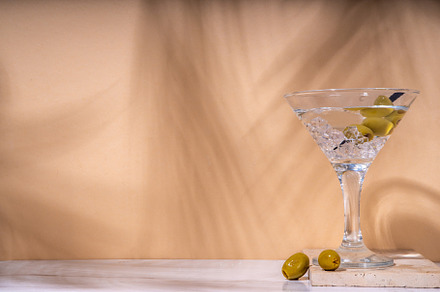 Classic martini cocktail with olive, a Food & Drink Photo by Rimma