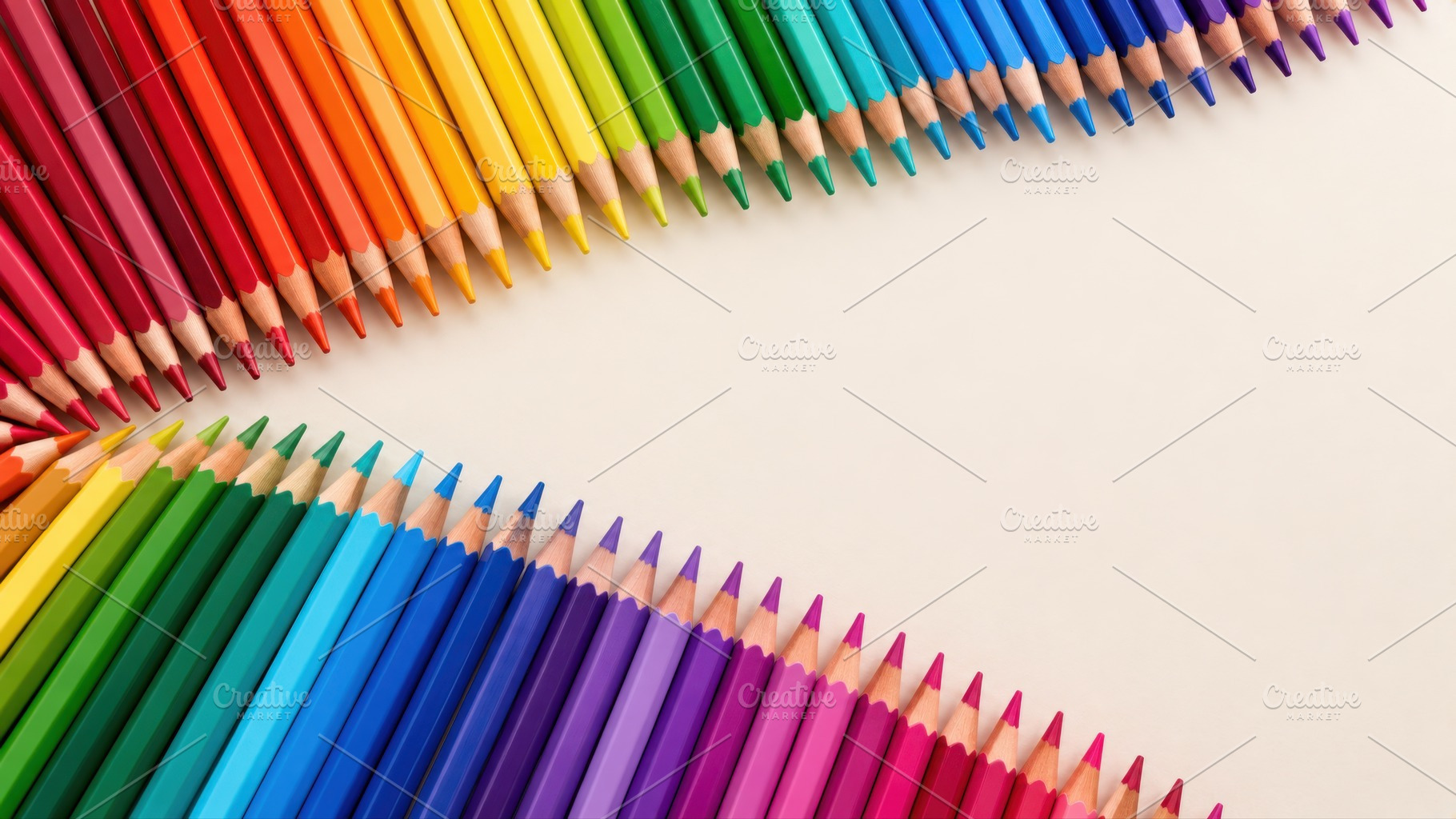 Colorful pencils arranged in a wave, a Photo by Beautiful things