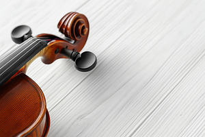 Violin on wooden background, an Arts & Entertainment Photo by AlyaAnd