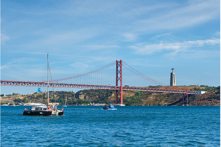 View of 25 de Abril Bridge over, a Transportation Photo by f9photos