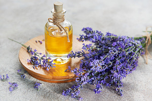 Lavender essential oil bottle with fresh flowers, a Health & Medical Photo by Olena Rudo