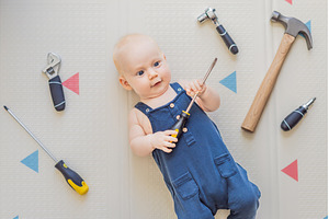 Adorable baby in a mechanic costume, a School & Education Photo by Elizaveta Galitskaya