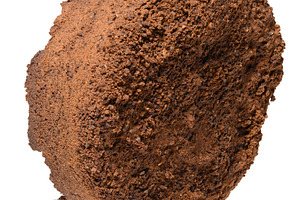Pressed tablet of used ground coffee, coffee puck or cake, a Food & Drink Photo by ndanko