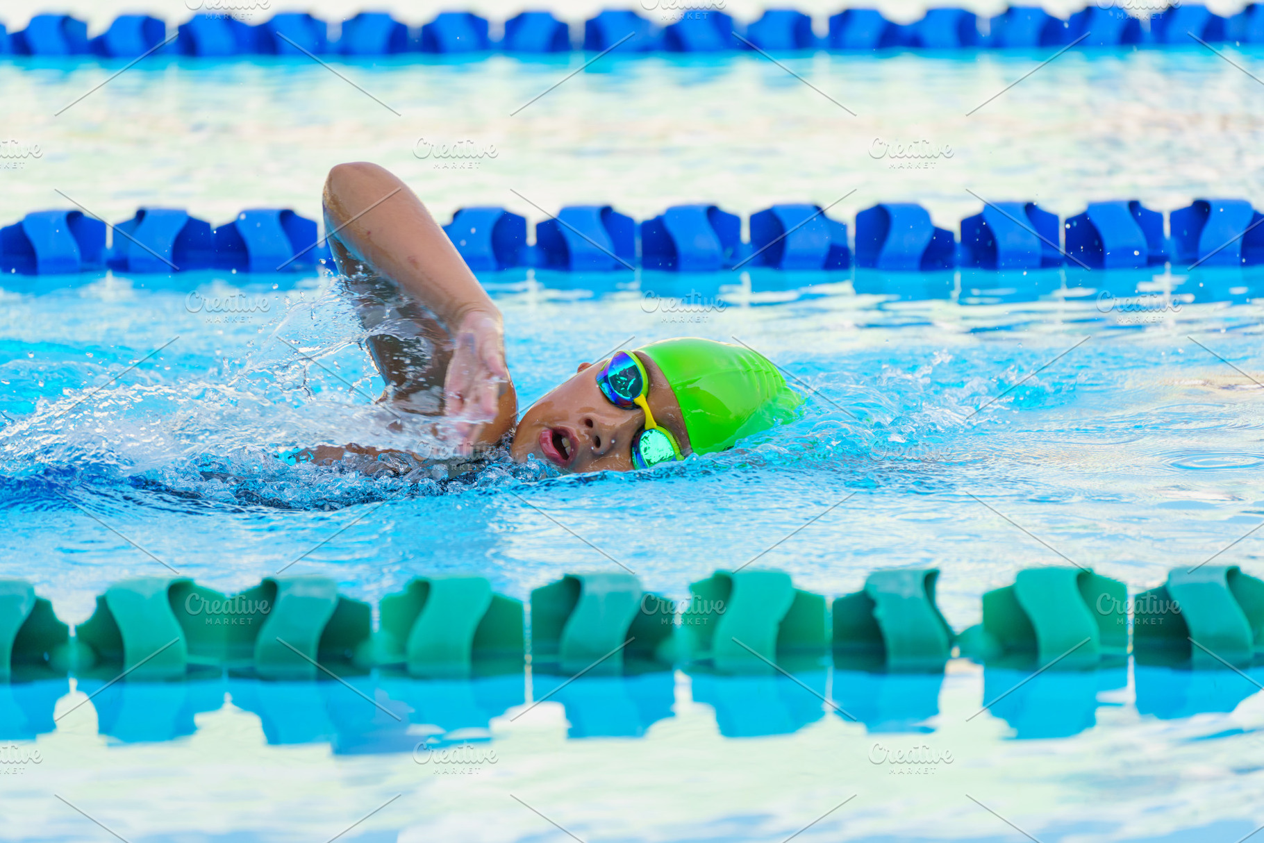Swimmer child swims freestyle swimmi, a Sports & Recreation Photo by Casanowe-studio