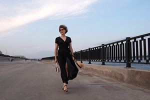 Woman in wrap dress walks, a Person Photo by Elena Vagengeim