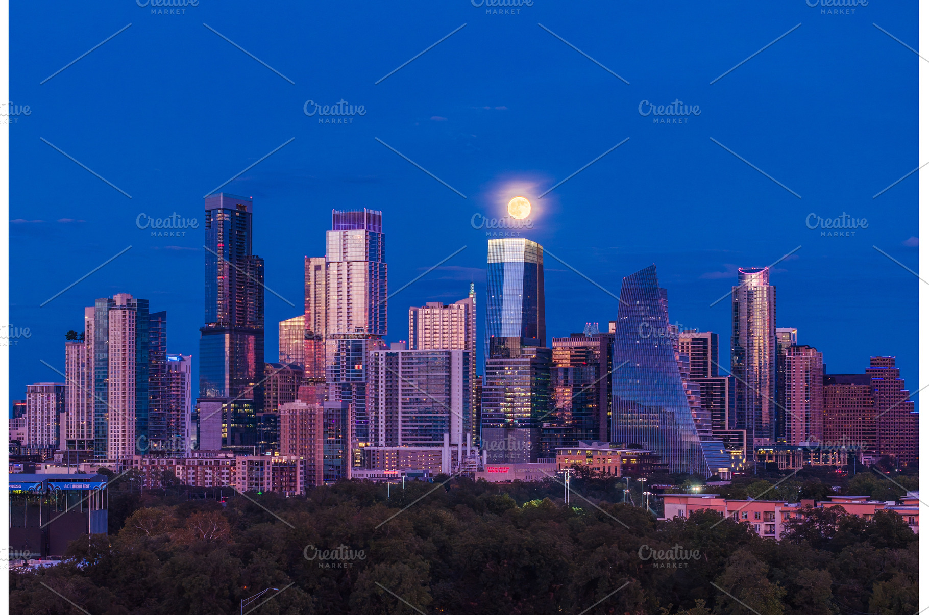 Harvest moon in the Austin skyline, an Architecture Photo by Backyard Stock