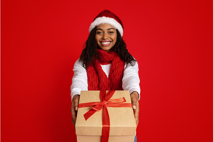 Happy young black lady holding, a Person Photo by Prostock-Studio