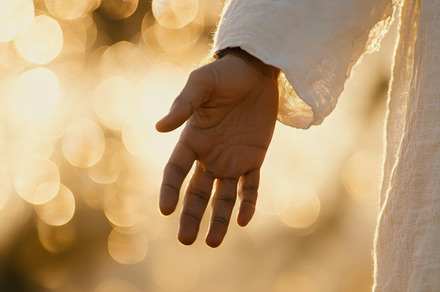 Hand of Jesus reaching out with light in spiritual scene, copy s, a Photo by Dvoevnore photos