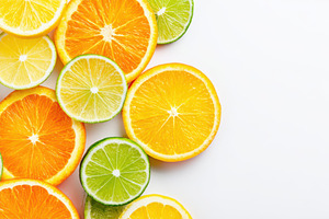 Sliced Citrus Fruits on White Background, a Food & Drink Photo by AlyaAnd