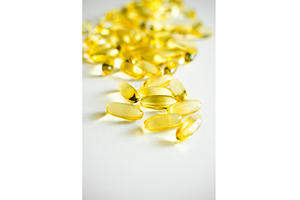 Close-up of shiny fish oil capsules, a Health & Medical Photo by volodymyrshtun13795