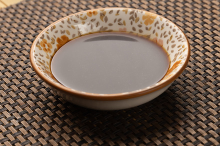Small bowl containing soy sauce