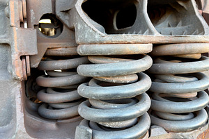 Close-up of metal springs and machinery components, showcasing rust and wear, an Industrial Photo by Textures & Backgrounds