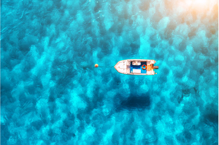 Aerial view of beautiful little boat, a Nature Photo by den-belitsky