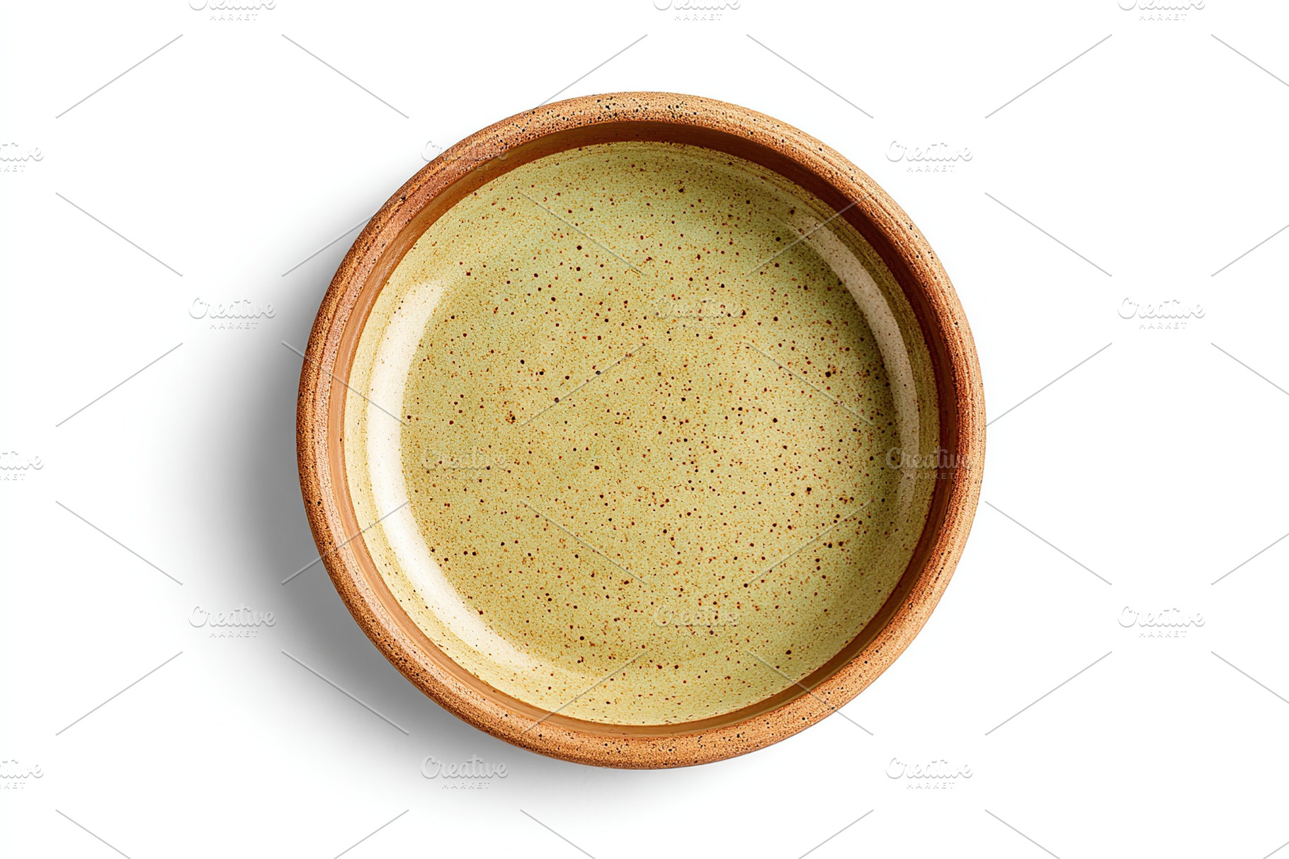 Empty round ceramic plate with sandy color and speckled green interior on a whi, a Food & Drink Photo by AlyaAnd